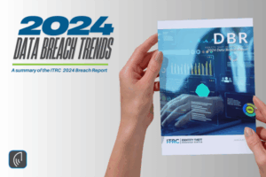 Hands holding the 2024 Data Breach Report by the Identity Theft Resource Center (ITRC), featuring a cover with cybersecurity graphics and data visualizations.