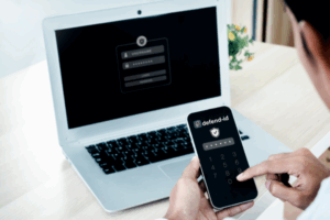 Employee using two-factor authentication to protect identity on phone and laptop