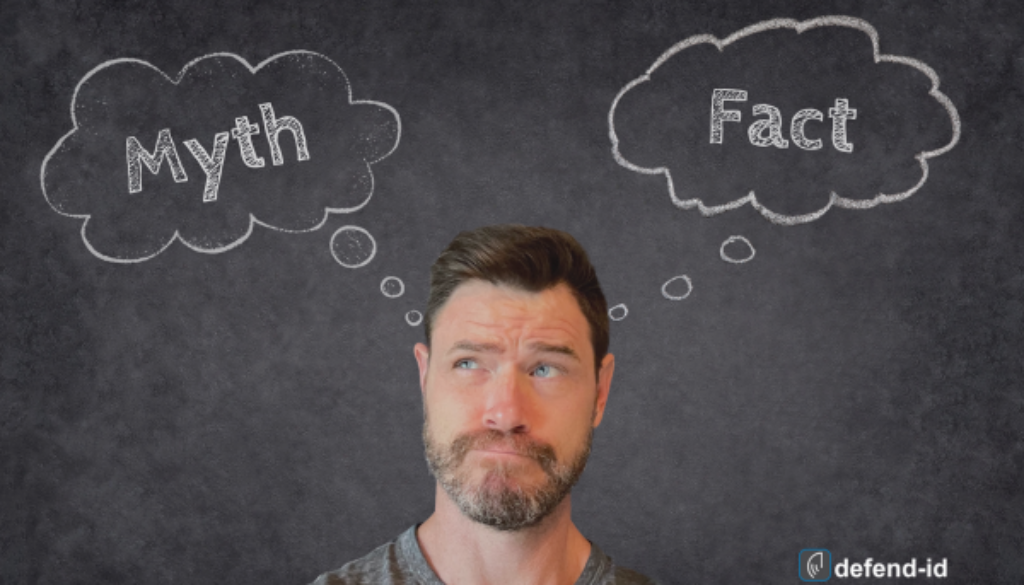 author standing in front of a chalkboard looking at thought bubbles. one bubble showing the word myth and the other showing the word fact