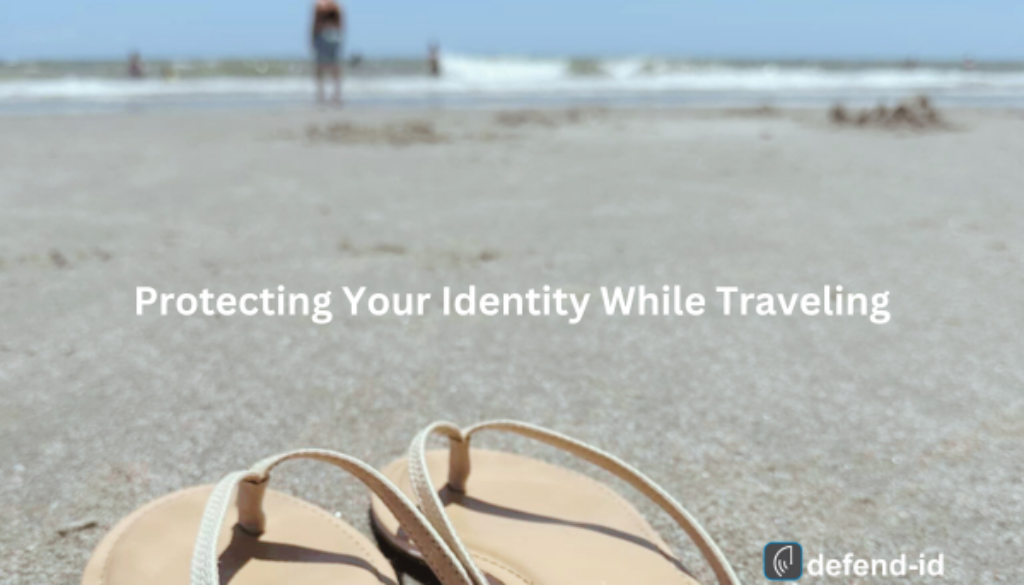 Close-up of sandals on a sandy beach with a person in the background by the ocean. Text overlay reads 'Protecting Your Identity While Traveling' with the defend-id logo