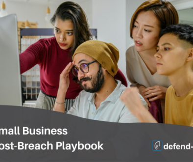 Small business team collaborating on a post-breach playbook at a computer with defend-id branding